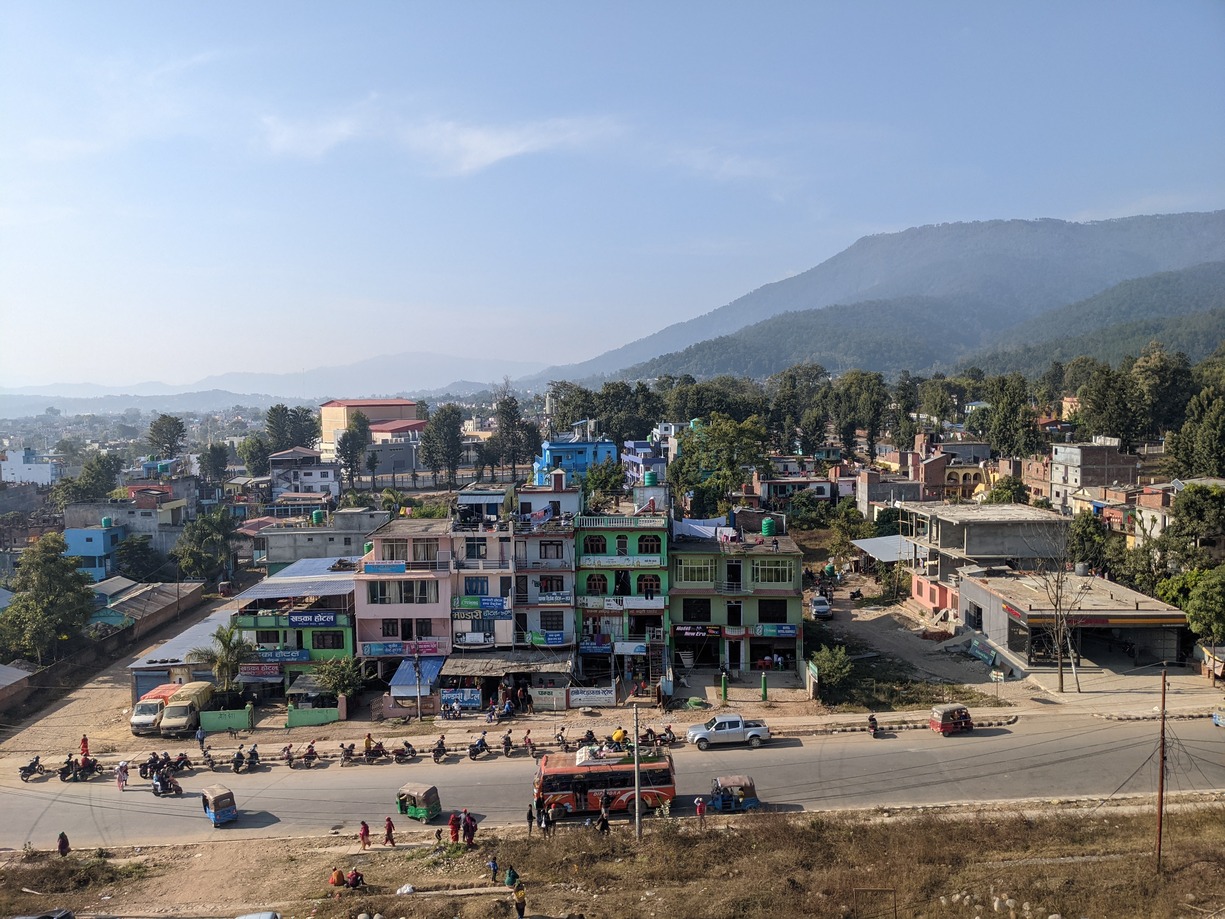 Birendranagar's urban settlements nestle in the foothills of the mountains, surrounded by abundant greenery.