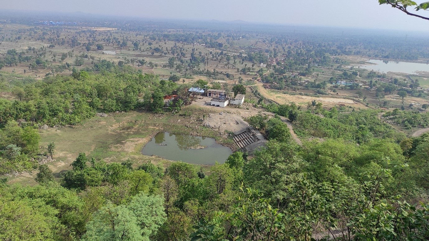 A landscape dotted with natural waterbodies and vast open lands.