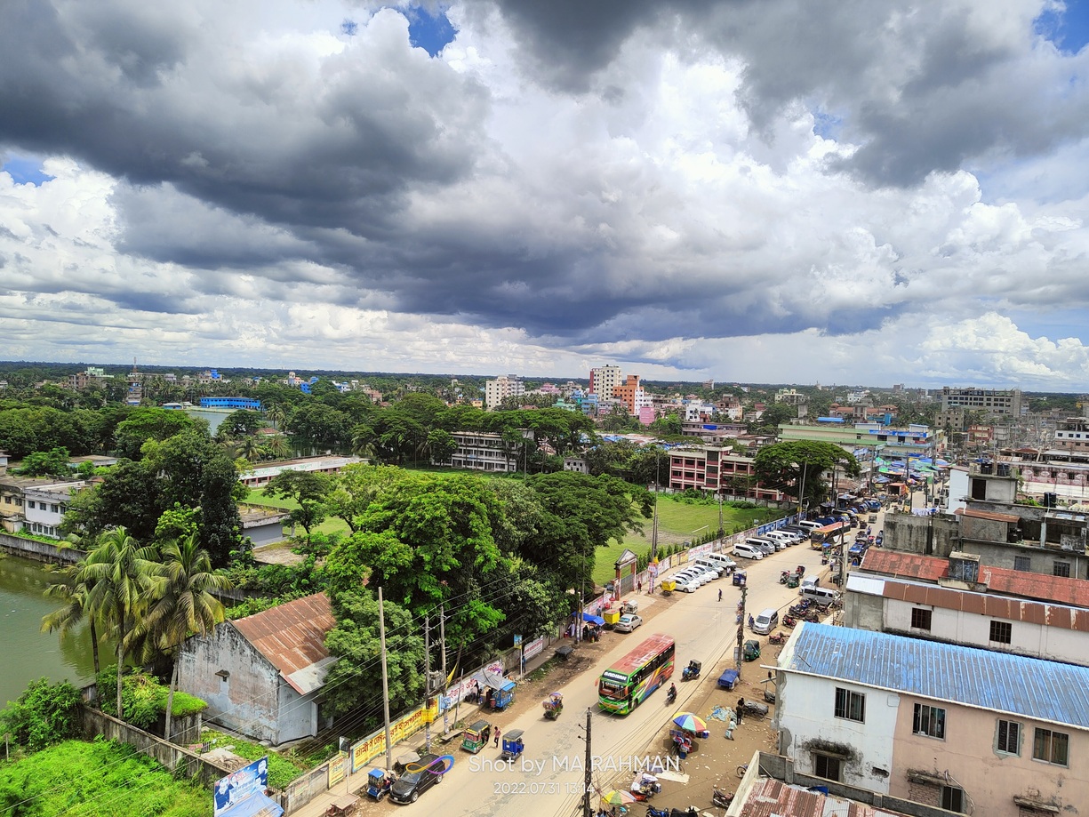 Townscape of Noakhali showcasing various housing typologies amongst waterbodies and greens.